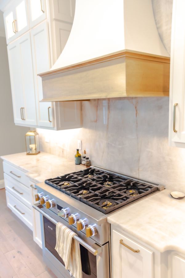 New construction kitchen with custom mixed wood cabinetry